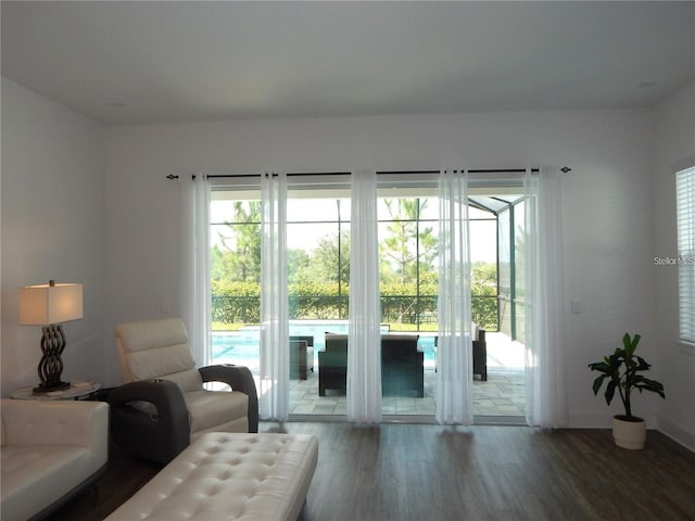 living room featuring wood finished floors and baseboards