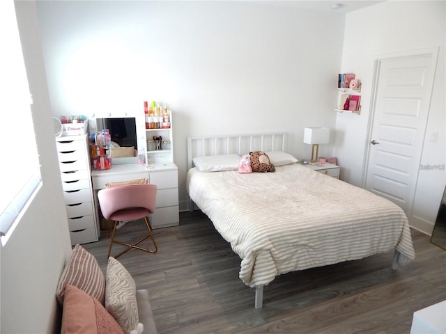 bedroom featuring wood finished floors