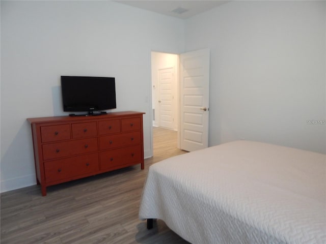 bedroom with light wood-style flooring