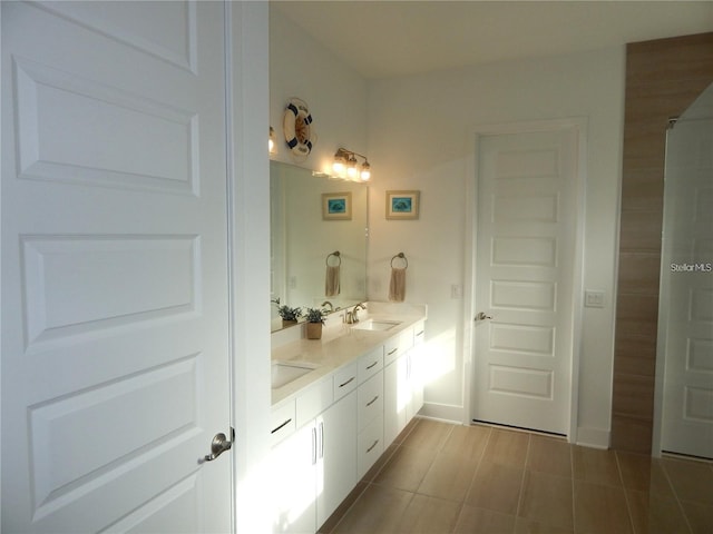 bathroom featuring double vanity and tile patterned flooring