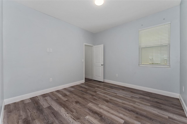 12845 Sawgrass Pine Cir, Orlando, FL 32824 - unfurnished room with dark wood-style floors and baseboards