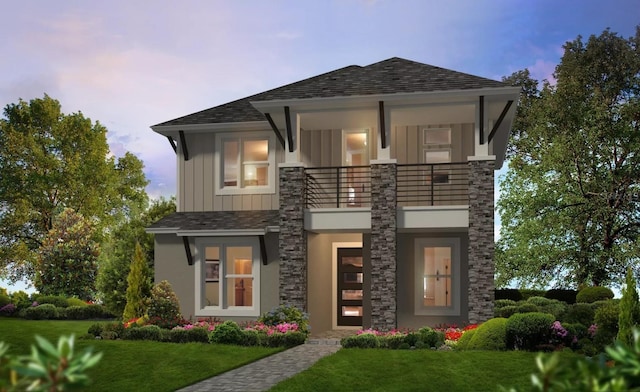 view of front facade featuring a balcony, stone siding, and a front lawn