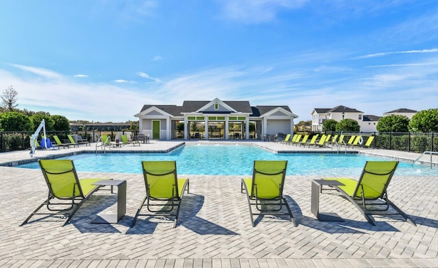 community pool with a patio area
