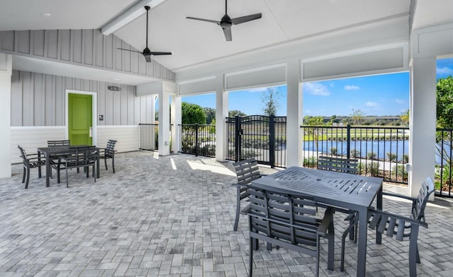 sunroom / solarium with a water view