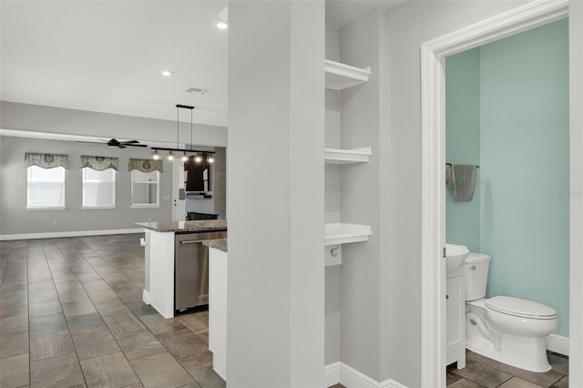15975 Marina Bay Dr, Winter Garden, FL 34787 - interior space with toilet, a ceiling fan, vanity, baseboards, and recessed lighting