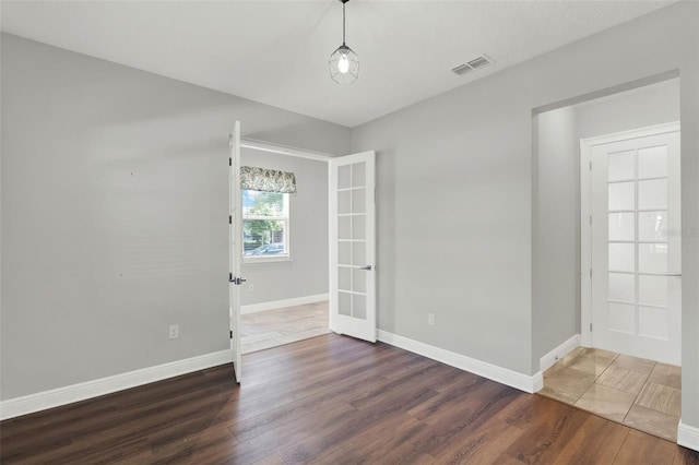 15975 Marina Bay Dr, Winter Garden, FL 34787 - empty room with wood finished floors, baseboards, and french doors