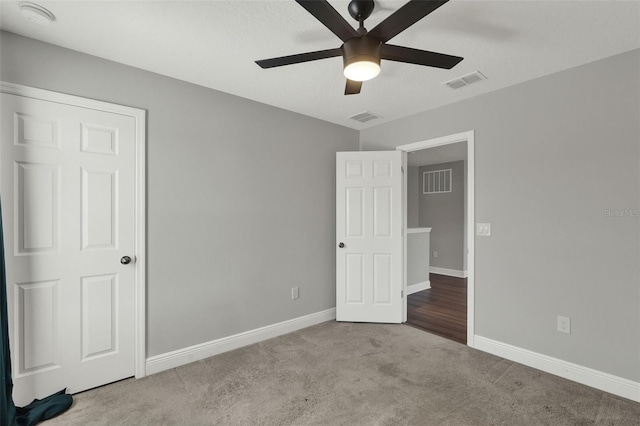 15975 Marina Bay Dr, Winter Garden, FL 34787 - unfurnished bedroom featuring carpet flooring, baseboards, and ceiling fan