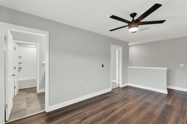 15975 Marina Bay Dr, Winter Garden, FL 34787 - spare room featuring a ceiling fan, wood finished floors, and baseboards