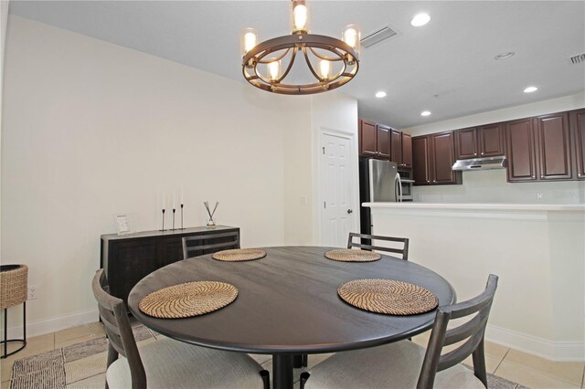 6941 Piazza St, Orlando, FL 32819 - dining room with a chandelier, light tile patterned floors, baseboards, and recessed lighting