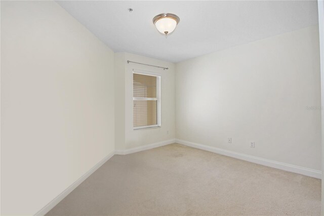 6941 Piazza St, Orlando, FL 32819 - spare room featuring light colored carpet and baseboards
