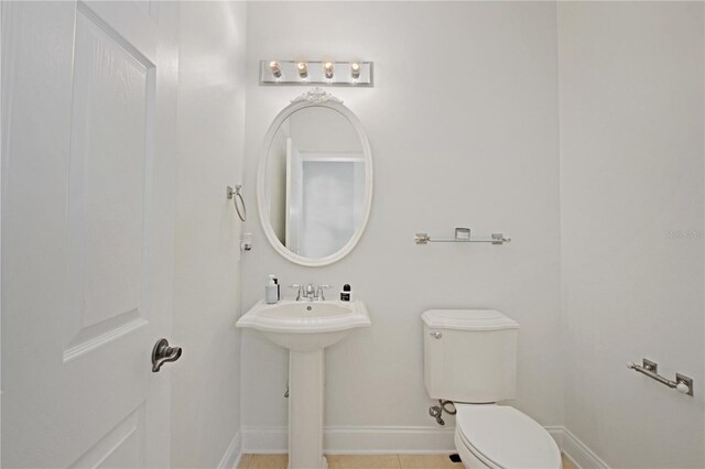 6941 Piazza St, Orlando, FL 32819 - bathroom with toilet and baseboards