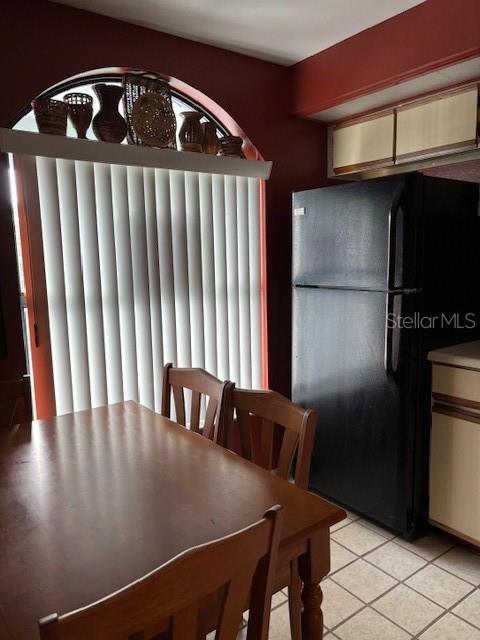 25306 Northlake Dr Unit 25306, Sanford, FL 32773 - dining room with light tile patterned floors