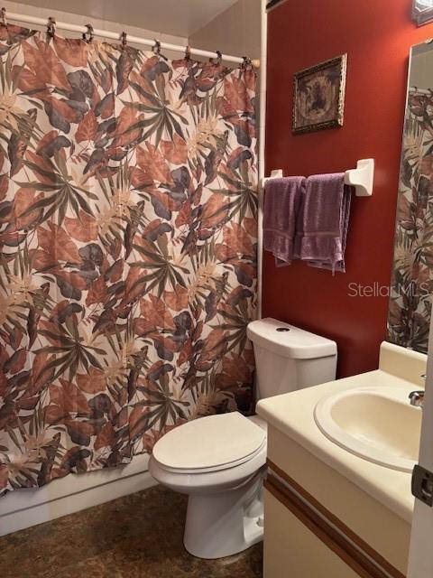 25306 Northlake Dr Unit 25306, Sanford, FL 32773 - bathroom with vanity, toilet, and curtained shower