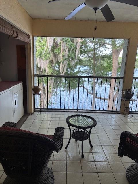 25306 Northlake Dr Unit 25306, Sanford, FL 32773 - sunroom / solarium with washing machine and dryer