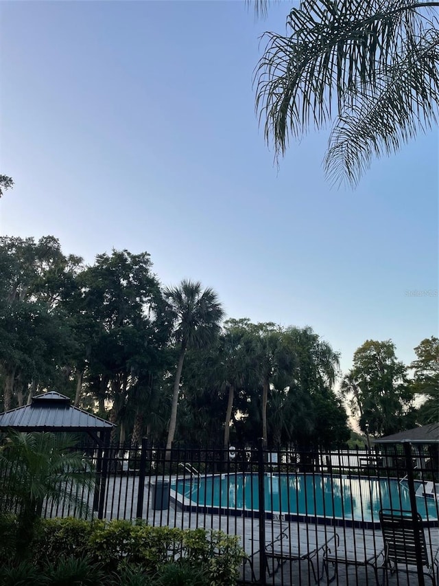 25306 Northlake Dr Unit 25306, Sanford, FL 32773 - community pool with a gazebo and a patio