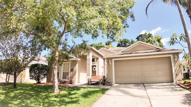 2343 Walnut Heights Rd, Apopka, FL 32703 - ranch-style house with stucco siding, a garage, driveway, and a front lawn