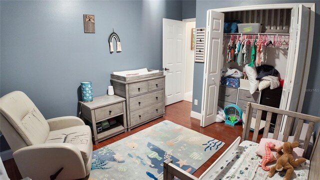 2343 Walnut Heights Rd, Apopka, FL 32703 - bedroom featuring wood finished floors and a closet