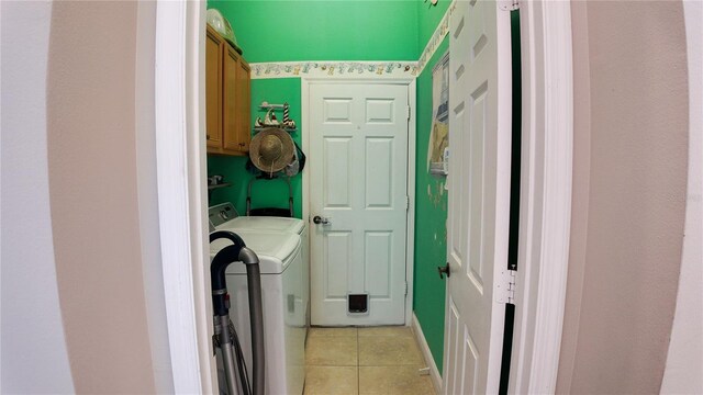 2343 Walnut Heights Rd, Apopka, FL 32703 - laundry room featuring cabinet space, light tile patterned floors, and separate washer and dryer