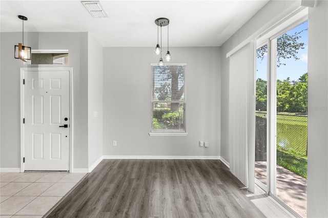 2430 Little Gem Loop, Sanford, FL 32773 - unfurnished dining area with wood finished floors and baseboards