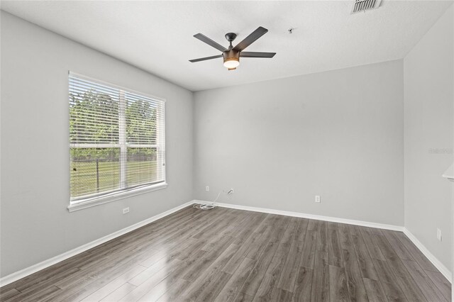 2430 Little Gem Loop, Sanford, FL 32773 - unfurnished room featuring wood finished floors, a ceiling fan, and baseboards