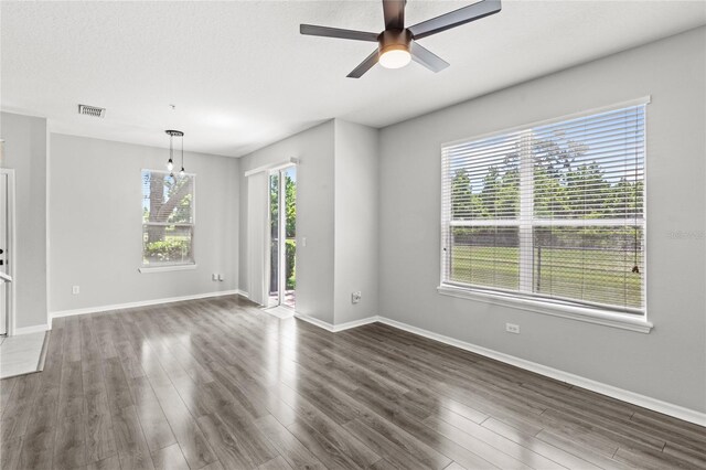 2430 Little Gem Loop, Sanford, FL 32773 - empty room featuring dark wood-style flooring, ceiling fan, and baseboards