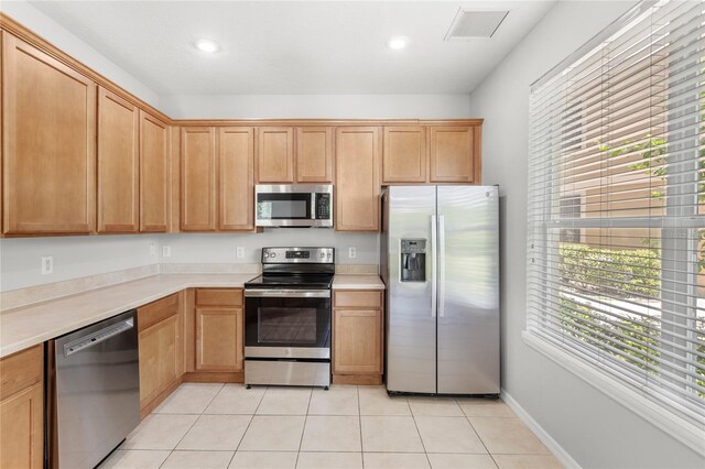 2430 Little Gem Loop, Sanford, FL 32773 - kitchen featuring appliances with stainless steel finishes, light countertops, light tile patterned flooring, and recessed lighting