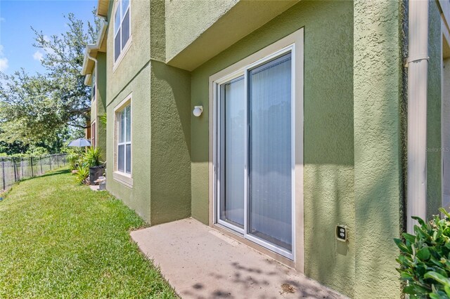 2430 Little Gem Loop, Sanford, FL 32773 - doorway to property with stucco siding