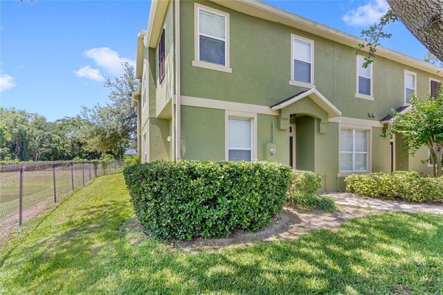 2430 Little Gem Loop, Sanford, FL 32773 - townhome / multi-family property featuring stucco siding
