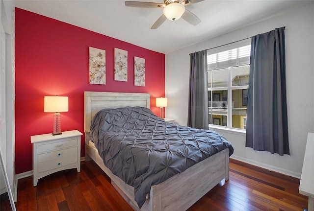 bedroom featuring hardwood / wood-style floors, baseboards, and ceiling fan