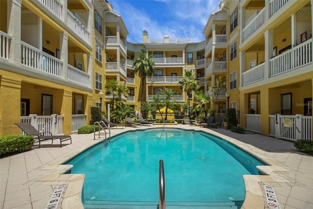 community pool featuring a patio area