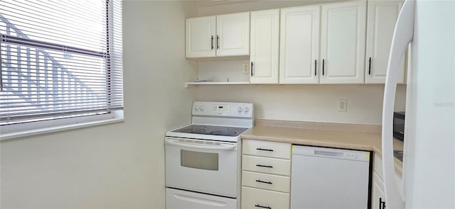 1504 Virginia Ave Unit 105, Daytona Beach, FL 32114 - kitchen featuring white appliances, open shelves, white cabinetry, and light countertops