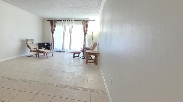 1504 Virginia Ave Unit 105, Daytona Beach, FL 32114 - sitting room with baseboards, light tile patterned flooring, ornamental molding, and a textured ceiling
