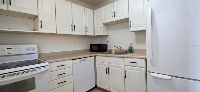 1504 Virginia Ave Unit 105, Daytona Beach, FL 32114 - kitchen featuring white appliances, a sink, white cabinets, light countertops, and ornamental molding