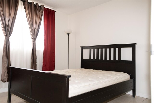 1504 Virginia Ave Unit 105, Daytona Beach, FL 32114 - bedroom featuring baseboards