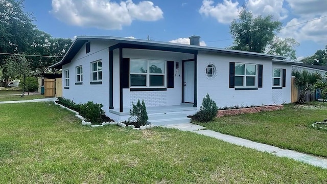 331 N Dollins Ave, Orlando, FL 32805 - view of front of home featuring a front yard