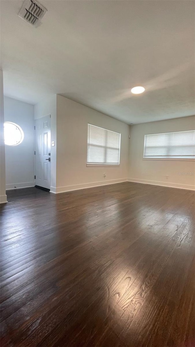 331 N Dollins Ave, Orlando, FL 32805 - unfurnished room with dark wood-type flooring and baseboards