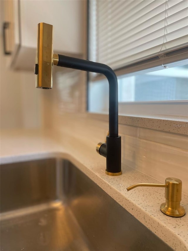 331 N Dollins Ave, Orlando, FL 32805 - kitchen view of light countertops and decorative backsplash