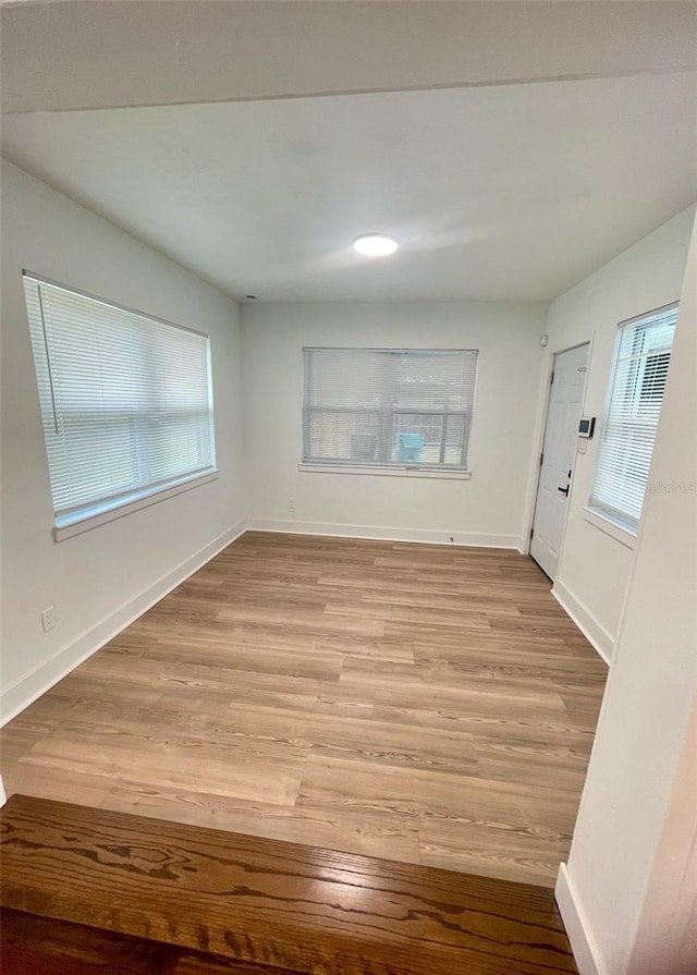 331 N Dollins Ave, Orlando, FL 32805 - spare room with wood finished floors and plenty of natural light