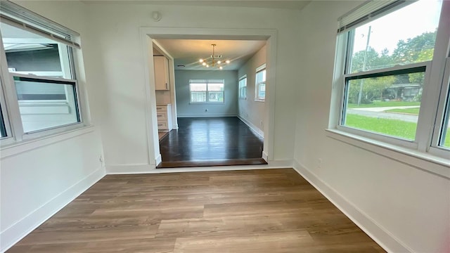 331 N Dollins Ave, Orlando, FL 32805 - unfurnished dining area featuring a chandelier and light wood-type flooring