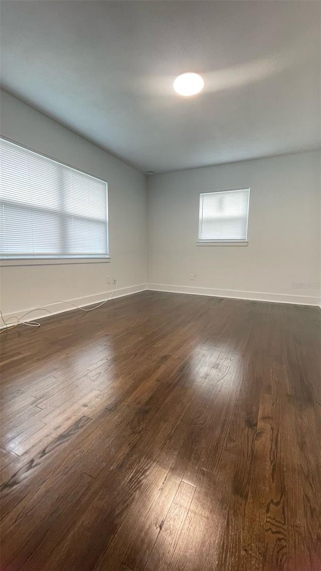 331 N Dollins Ave, Orlando, FL 32805 - spare room featuring dark wood-style floors and baseboards