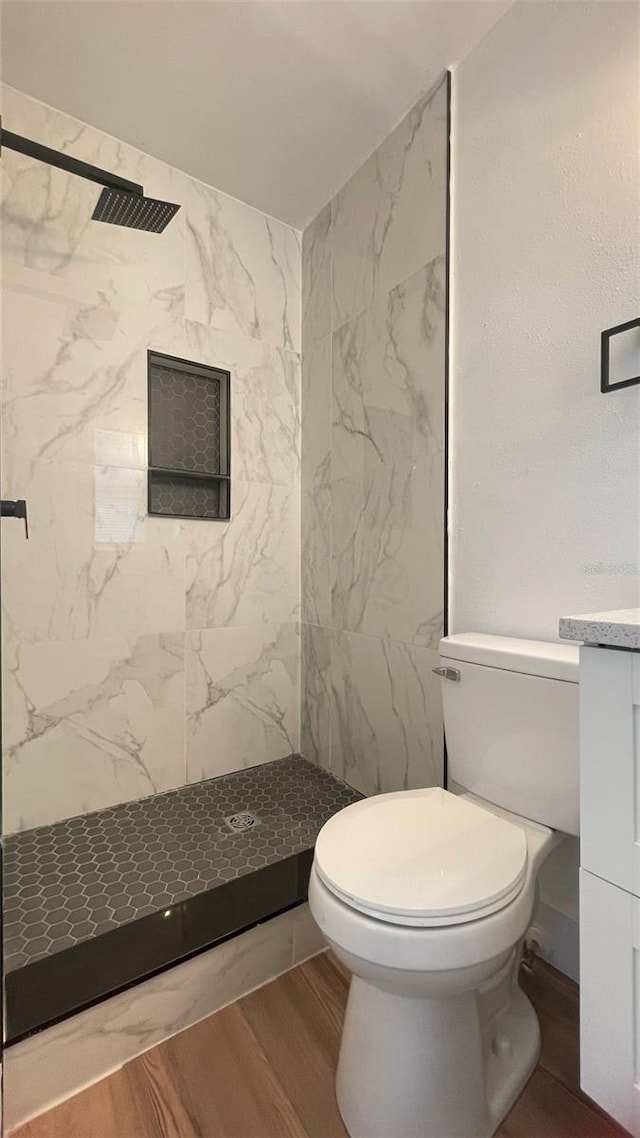 331 N Dollins Ave, Orlando, FL 32805 - full bathroom featuring a marble finish shower, wood finished floors, and vanity