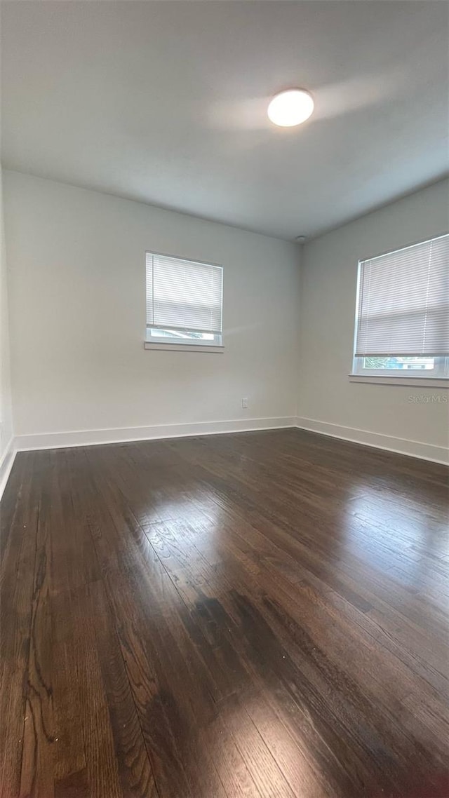 331 N Dollins Ave, Orlando, FL 32805 - empty room with dark wood-style floors and baseboards
