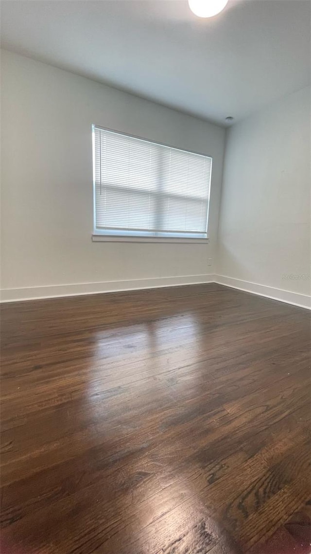 331 N Dollins Ave, Orlando, FL 32805 - spare room featuring dark wood-type flooring and baseboards