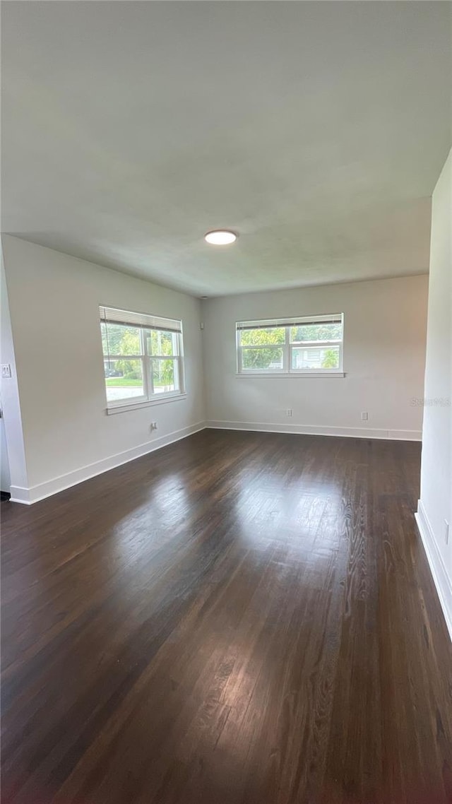 331 N Dollins Ave, Orlando, FL 32805 - empty room with dark wood-type flooring and baseboards
