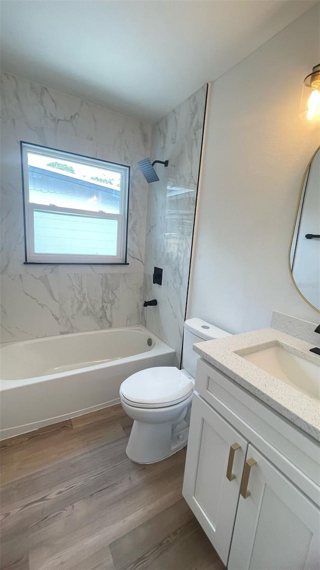 331 N Dollins Ave, Orlando, FL 32805 - full bath featuring vanity, tub / shower combination, and wood finished floors