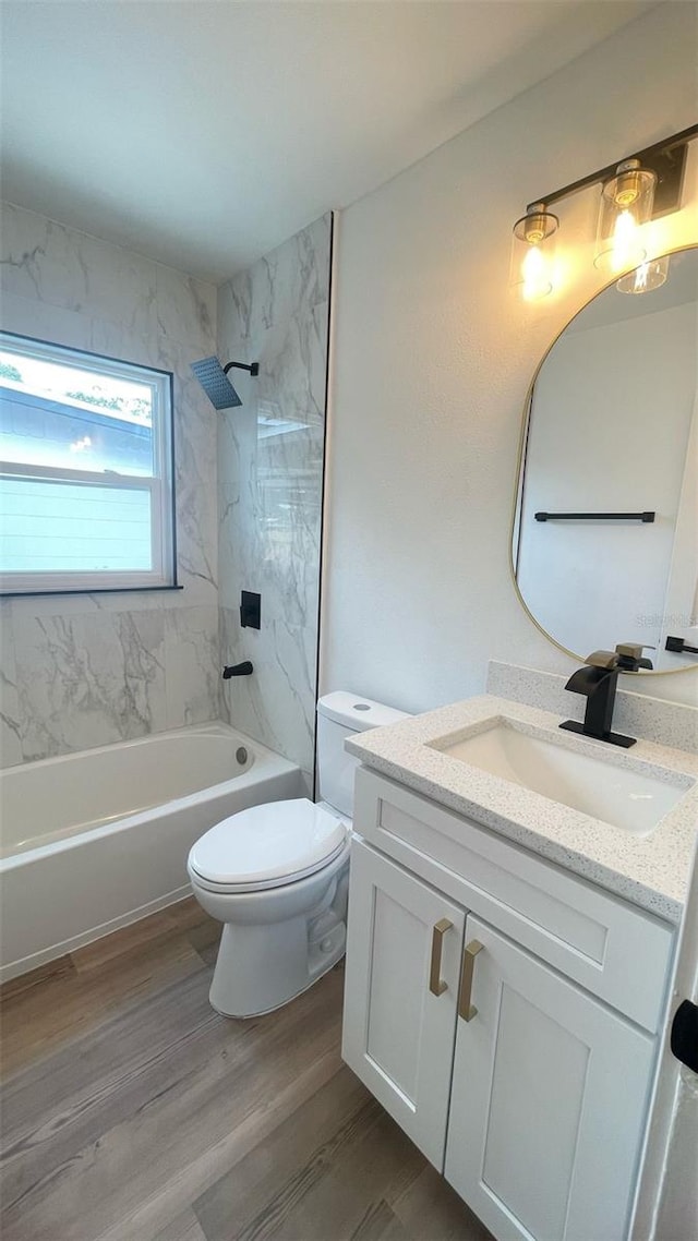 331 N Dollins Ave, Orlando, FL 32805 - bathroom featuring vanity, wood finished floors, and bathing tub / shower combination