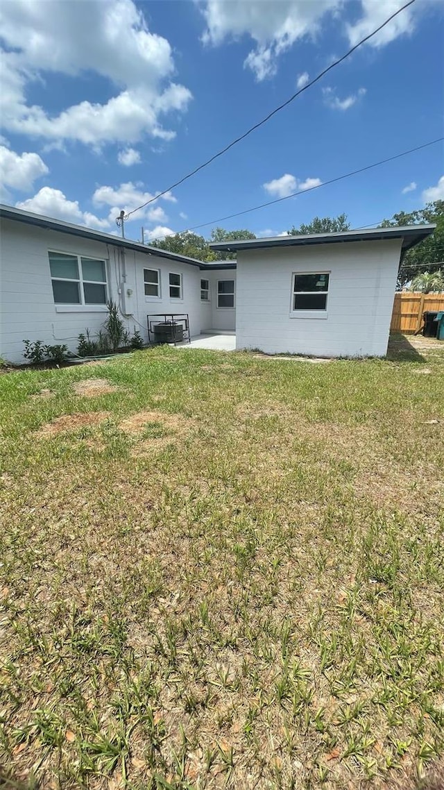 331 N Dollins Ave, Orlando, FL 32805 - rear view of house featuring a patio