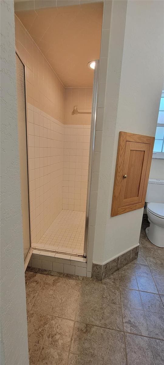 122 N Cedarview Ter, Inverness, FL 34453 - bathroom with a stall shower and toilet