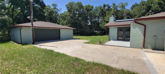 122 N Cedarview Ter, Inverness, FL 34453 - detached garage with french doors and view of scattered trees