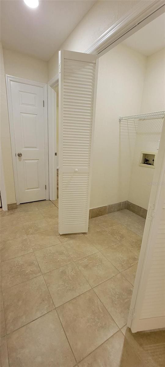 122 N Cedarview Ter, Inverness, FL 34453 - corridor featuring light tile patterned flooring and baseboards